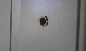 How to Install a Peephole In a Metal Door